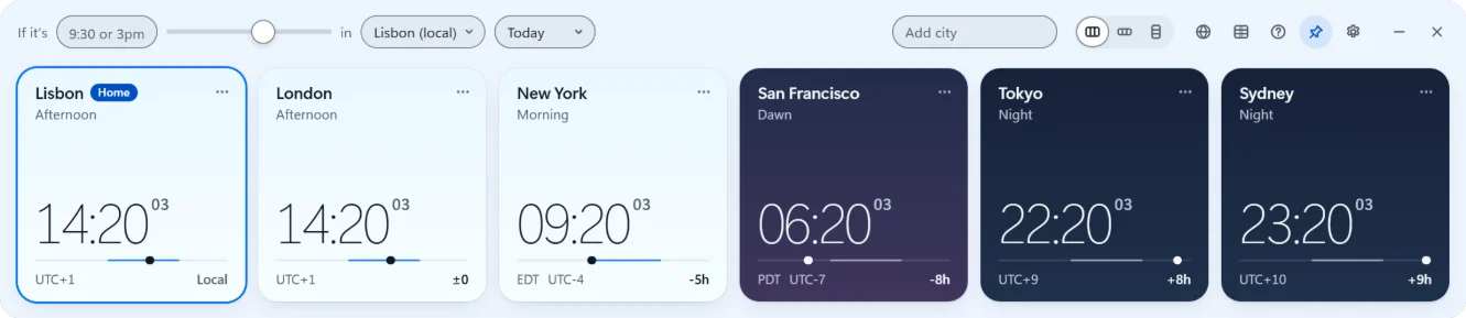 Open World Clock strip in the light theme: Lisbon marked Home and London at 14:20 in the afternoon, New York in the morning, San Francisco at dawn, Tokyo and Sydney on navy night cards.